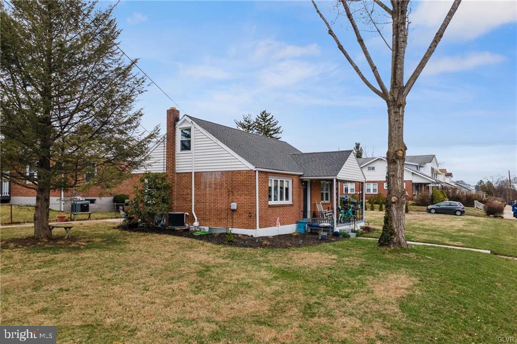 2051 Reading Avenue Reading, PA 19609 - Photo 3 of 45 a front view of a house with a yard