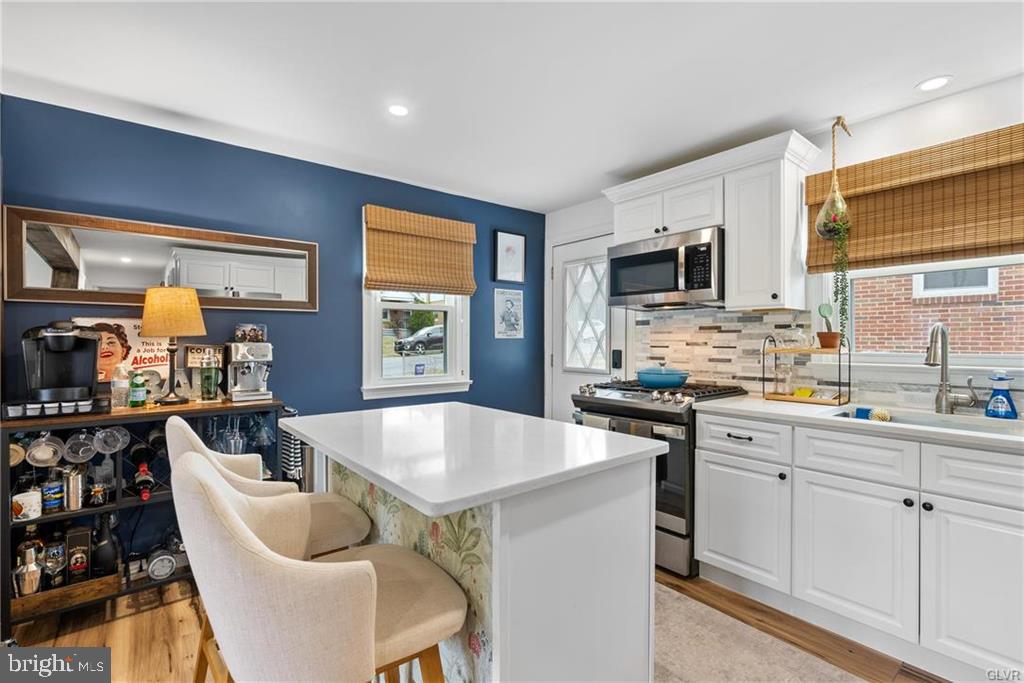 2051 Reading Avenue Reading, PA 19609 - Photo 8 of 45 a large kitchen with kitchen island granite countertop a sink and cabinets