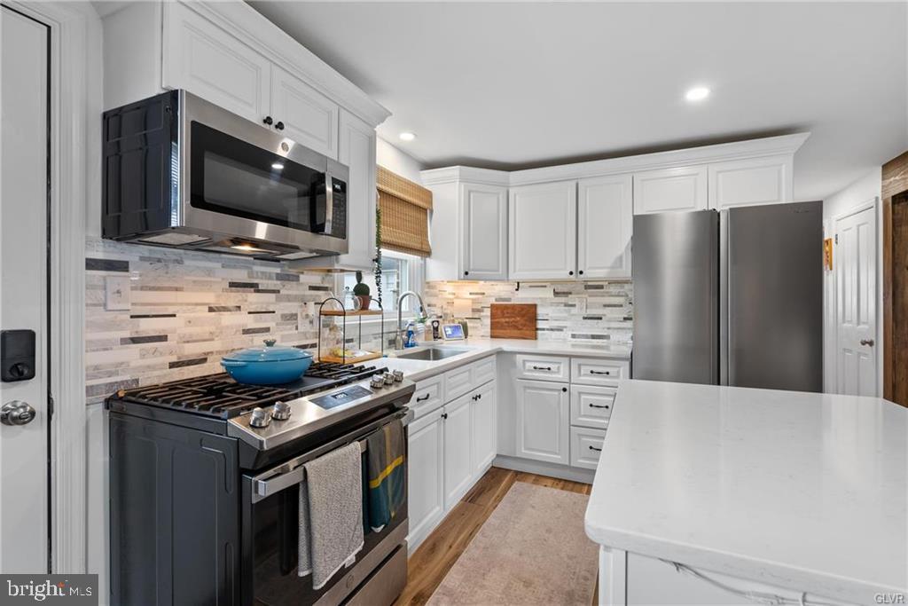 2051 Reading Avenue Reading, PA 19609 - Photo 9 of 45 a kitchen with stainless steel appliances a stove microwave and refrigerator