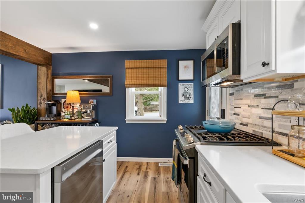 2051 Reading Avenue Reading, PA 19609 - Photo 10 of 45 a kitchen with a sink appliances and cabinets