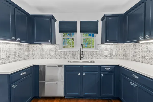 a kitchen with a stove and a microwave