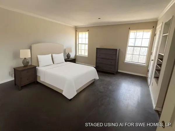 a bedroom with a bed a couch and a window