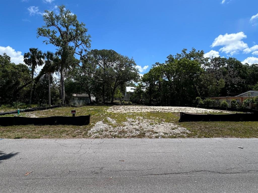 7814 Chapel Avenue Port Richey, FL 34668 - Photo 5 of 6 a view of a yard with wooden fence