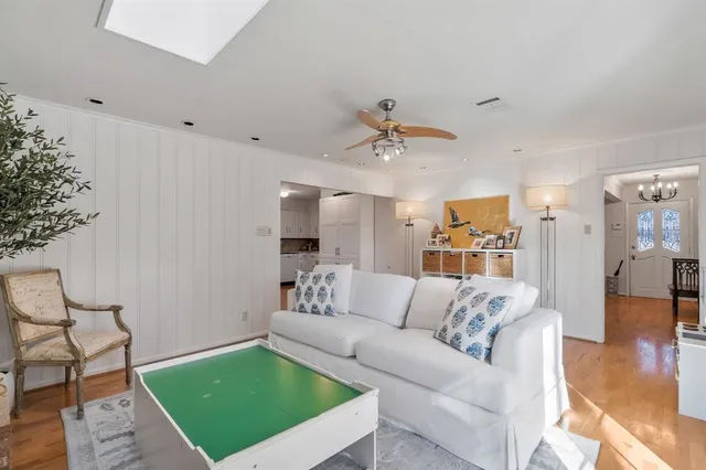 a view of a livingroom with furniture and wooden floor
