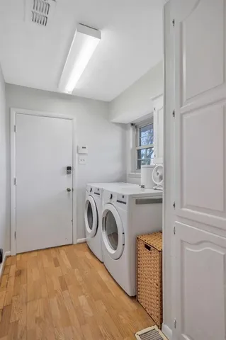 a view of a storage & utility room with washer and dryer