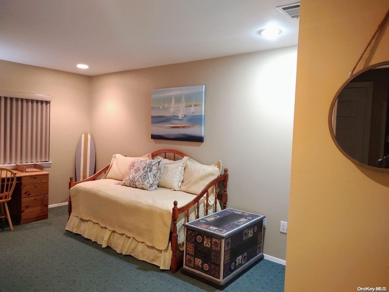 813 Shore Road Long Beach, NY 11561 - Photo 13 of 33 a bedroom with a bed and a painting on the wall