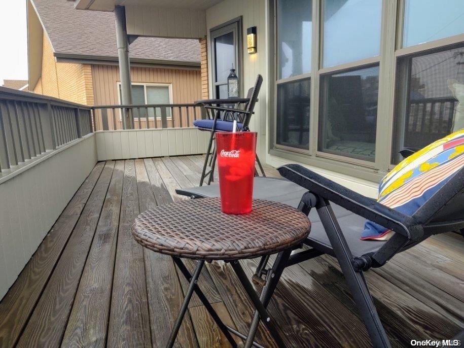813 Shore Road Long Beach, NY 11561 - Photo 14 of 33 a view of balcony with wooden floor and seating space