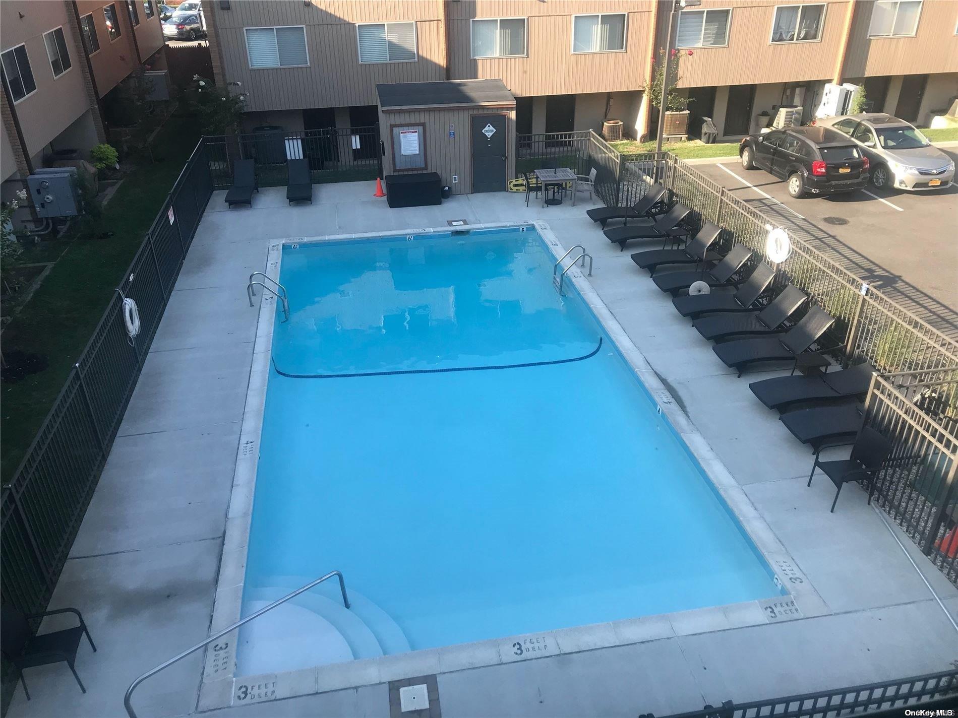 813 Shore Road Long Beach, NY 11561 - Photo 29 of 33 a view of a patio with table and chairs