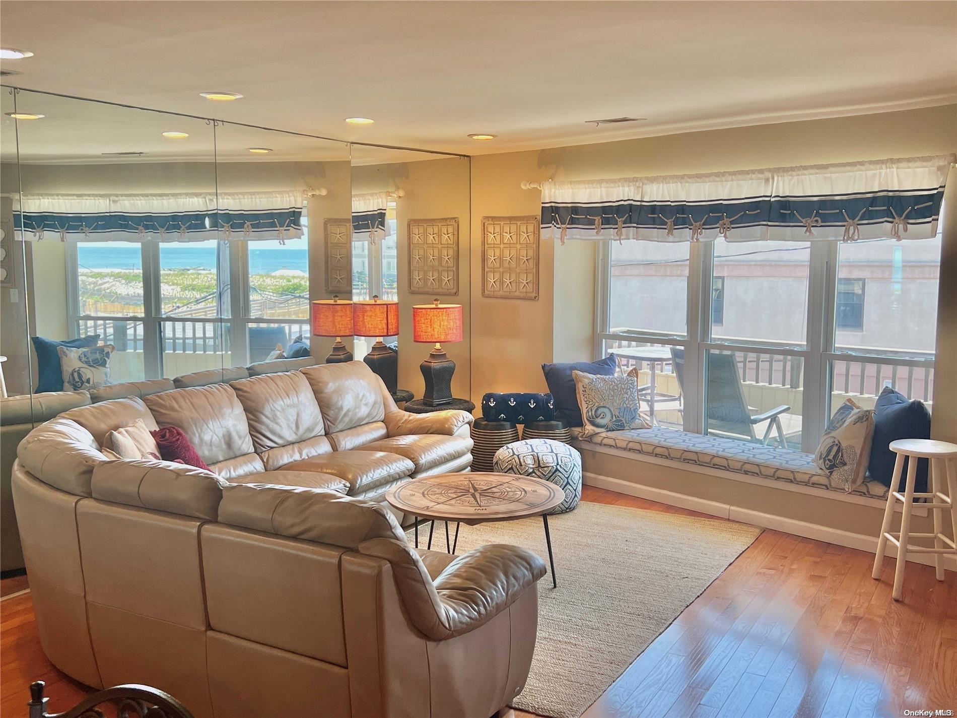 813 Shore Road Long Beach, NY 11561 - Photo 7 of 33 a living room with furniture and a large window