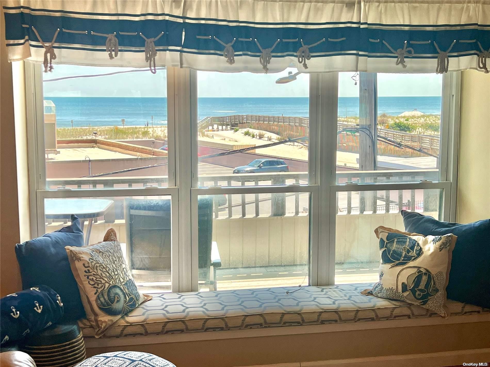 813 Shore Road Long Beach, NY 11561 - Photo 9 of 33 a living room with furniture and a window