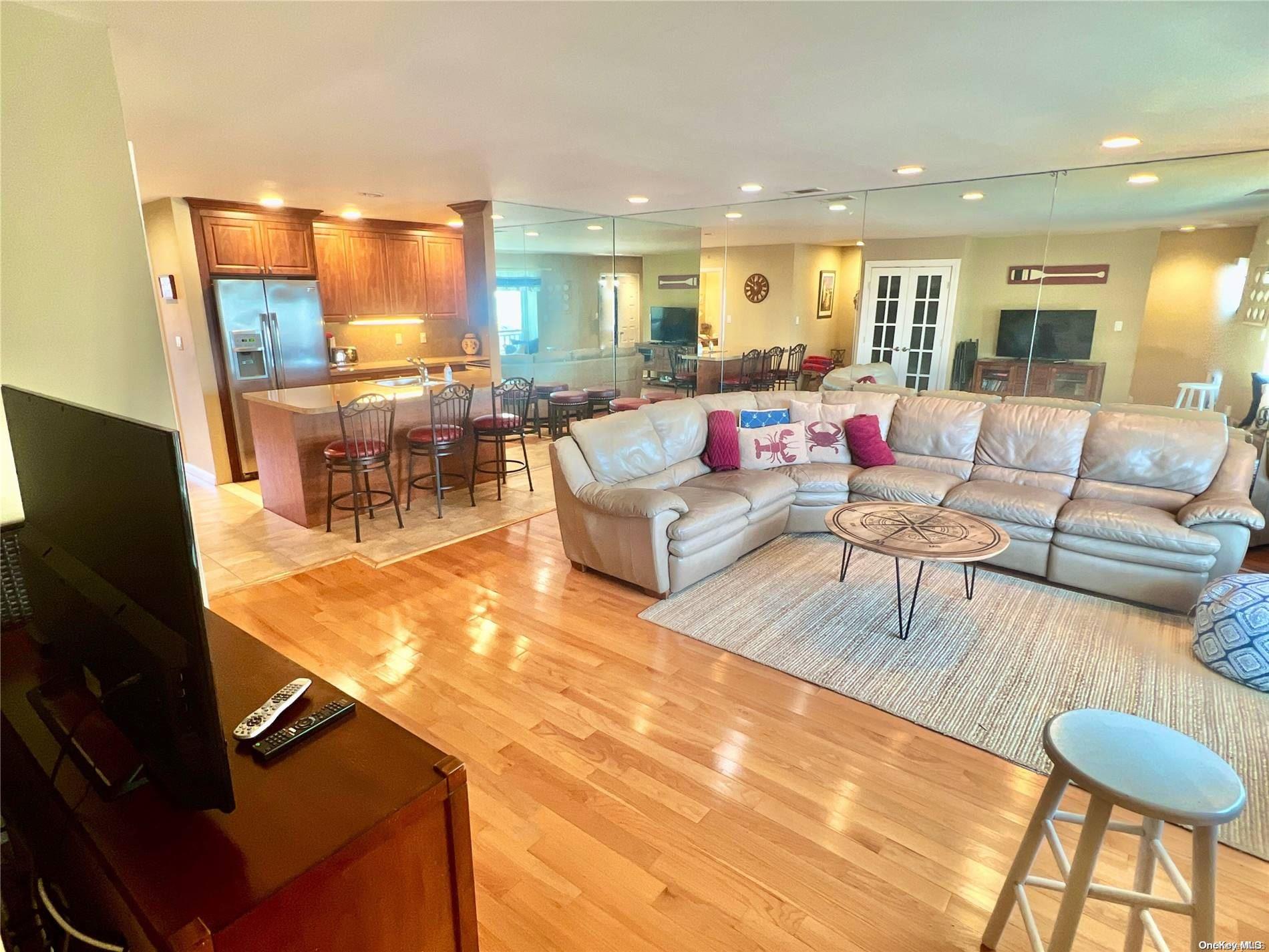 813 Shore Road Long Beach, NY 11561 - Photo 10 of 33 a living room with furniture and a flat screen tv