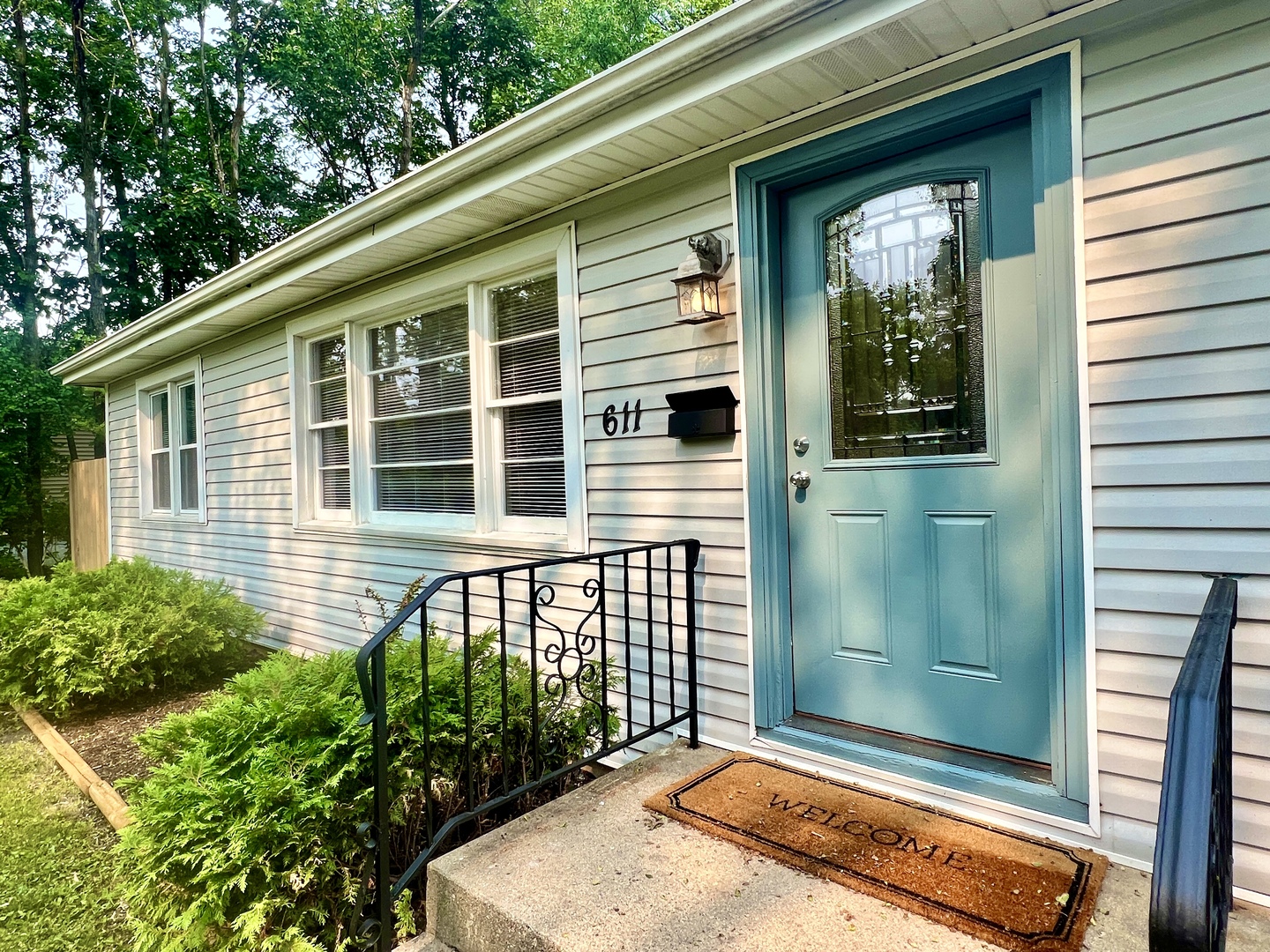 611 North Main Street Lombard, IL 60148 - Photo 1 of 17 a front view of a house with a garden