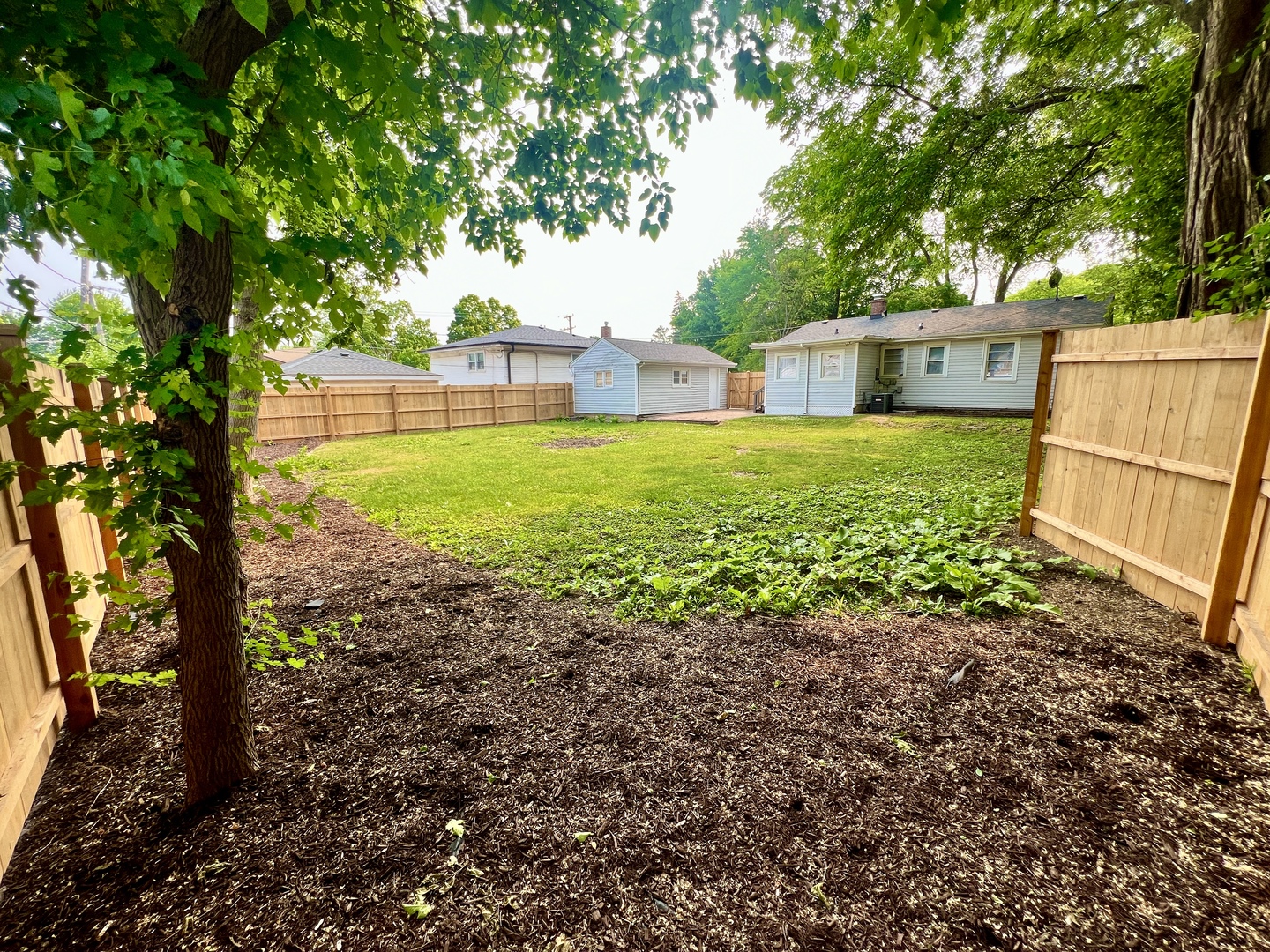 611 North Main Street Lombard, IL 60148 - Photo 15 of 17 a front view of a house with garden