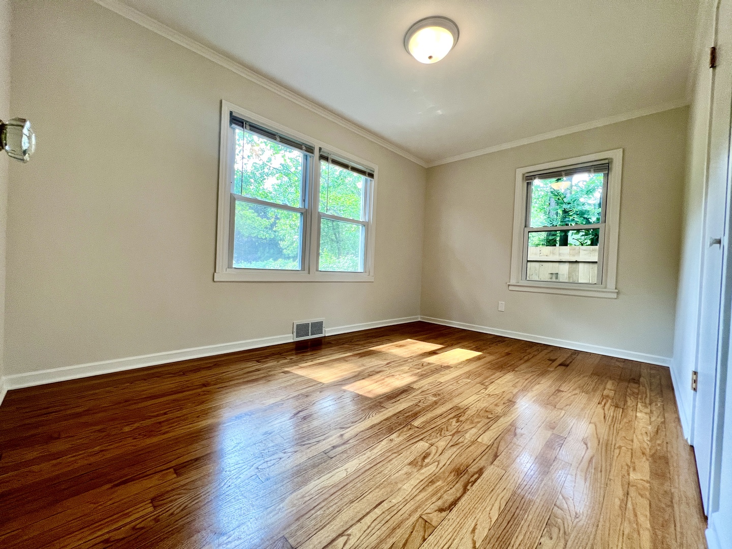 611 North Main Street Lombard, IL 60148 - Photo 5 of 17 a view of empty room with wooden floor and fan