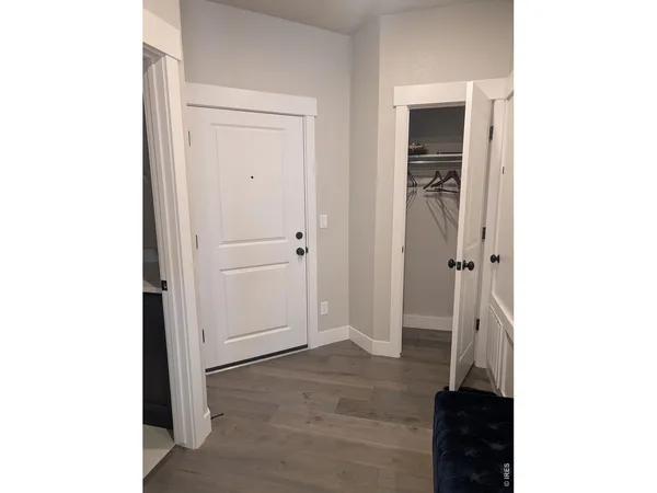 a view of a livingroom with wooden floor