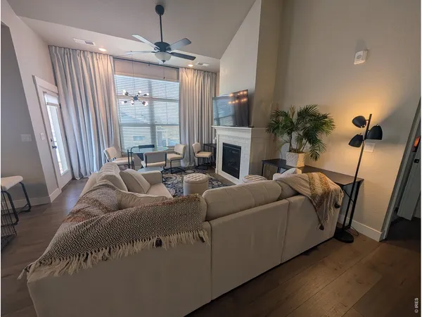 a living room with furniture fireplace and a flat screen tv