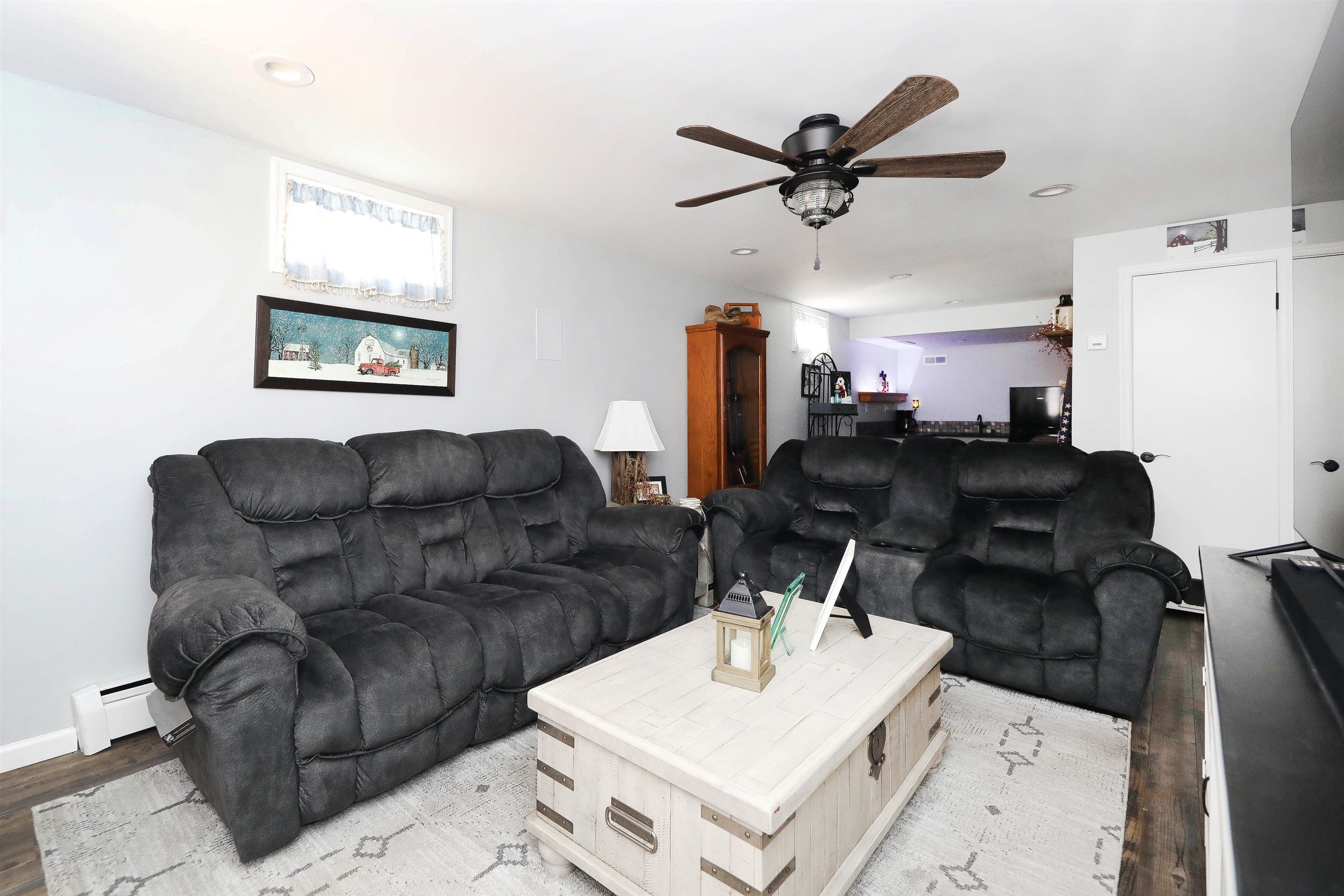1198 Spaulding Street Staunton, VA 24401 - Photo 28 of 48 a living room with furniture and a clock