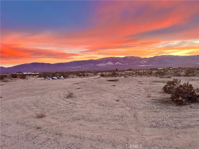 a view of a lake with mountains in the background