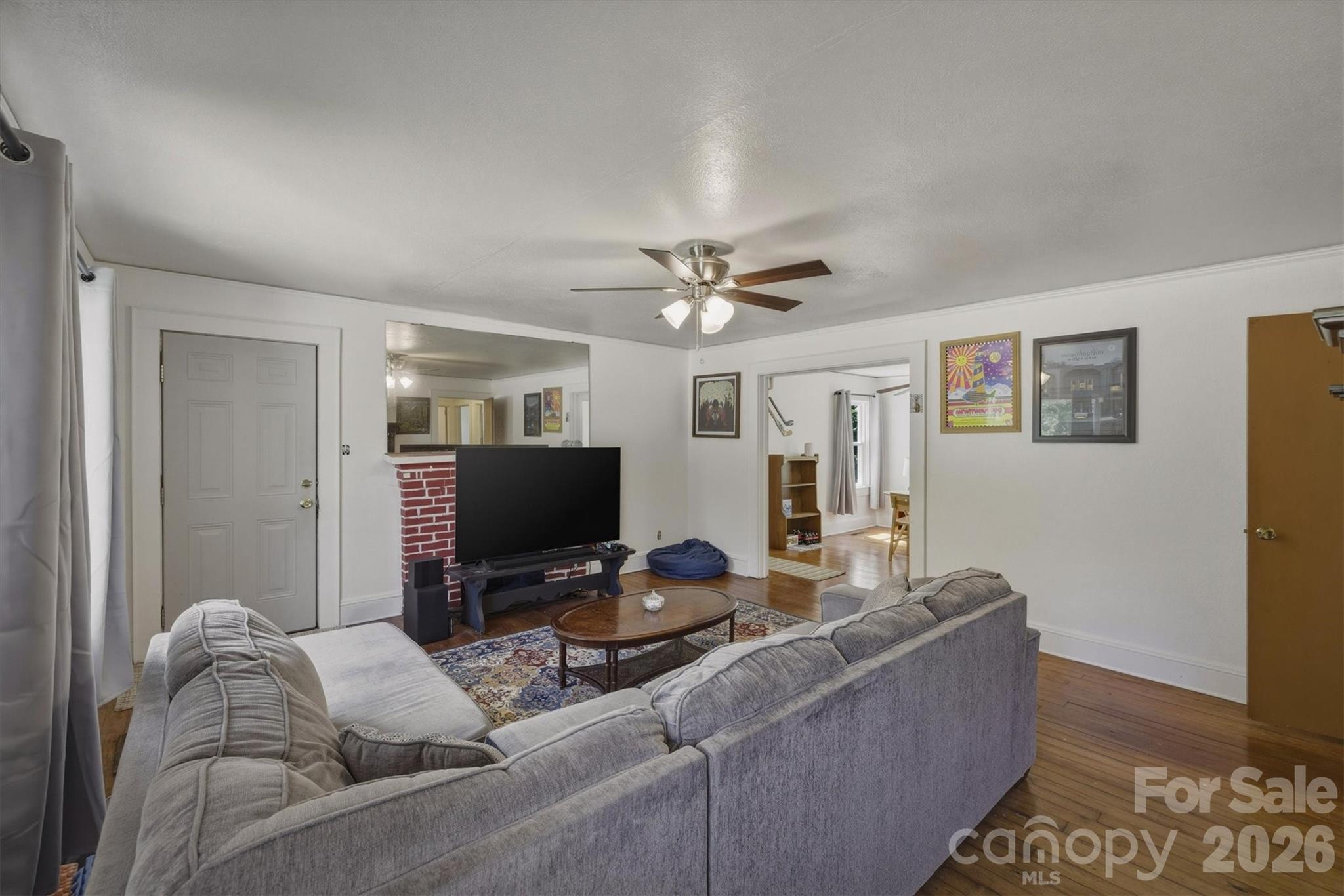 117 3rd Avenue Southwest Hickory, NC 28602 - Photo 8 of 21 a living room with furniture and a flat screen tv
