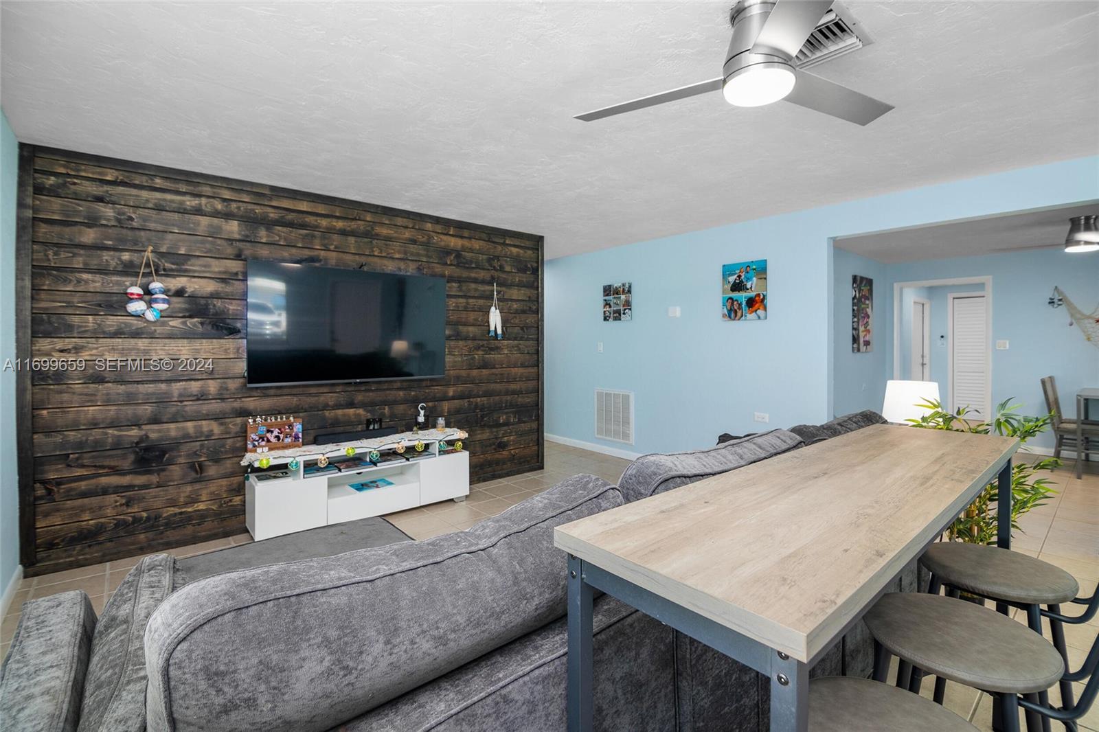 7951 Gulfstream Boulevard Marathon, FL 33050 - Photo 11 of 60 a living room with furniture and a flat screen tv