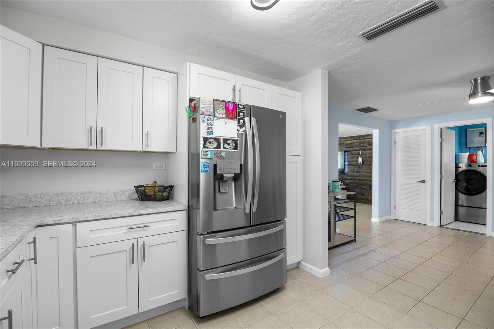 7951 Gulfstream Boulevard Marathon, FL 33050 - Photo 15 of 60 a kitchen with refrigerator and cabinets