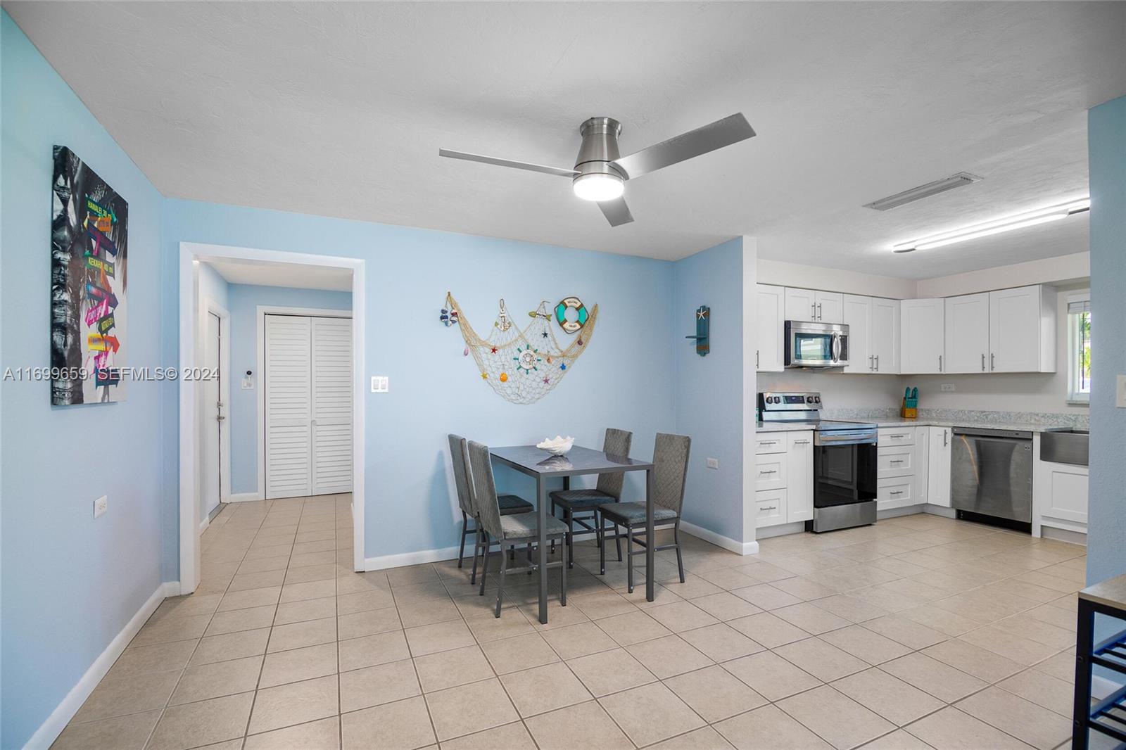 7951 Gulfstream Boulevard Marathon, FL 33050 - Photo 17 of 60 a view of a livingroom with furniture and a kitchen