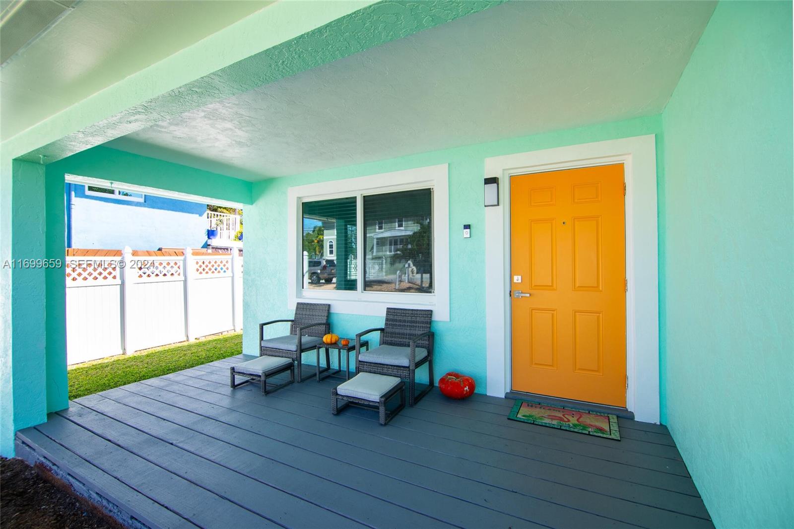 7951 Gulfstream Boulevard Marathon, FL 33050 - Photo 35 of 60 a backyard of a house with table and chairs