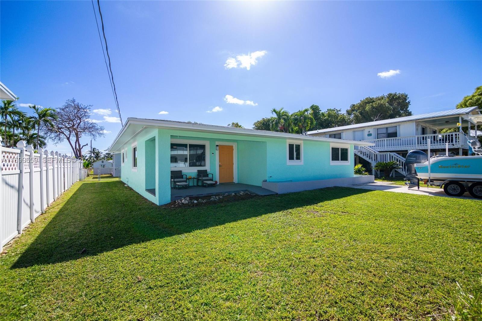 7951 Gulfstream Boulevard Marathon, FL 33050 - Photo 37 of 60 a view of a house with backyard and sitting area