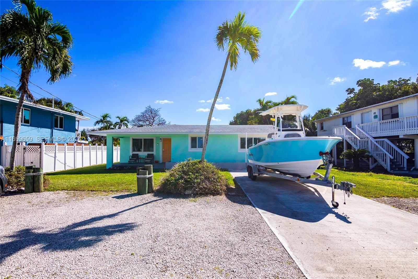 7951 Gulfstream Boulevard Marathon, FL 33050 - Photo 39 of 60 a view of a house with a yard and potted plants