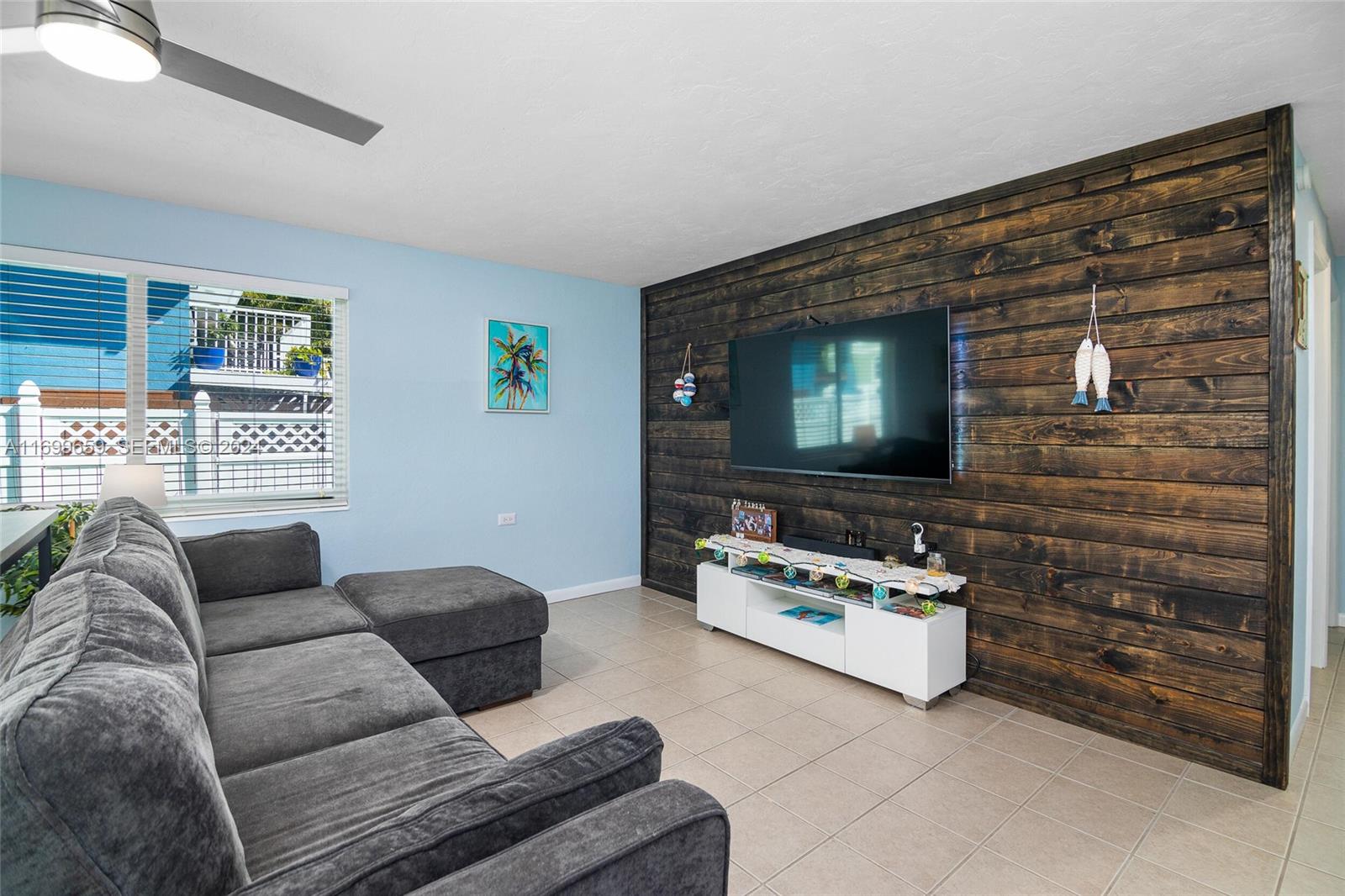 7951 Gulfstream Boulevard Marathon, FL 33050 - Photo 5 of 60 a living room with furniture and a flat screen tv