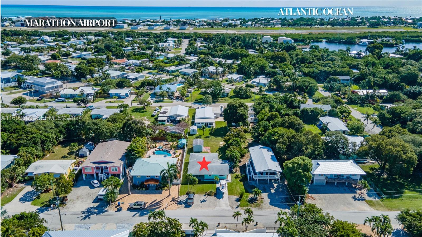 7951 Gulfstream Boulevard Marathon, FL 33050 - Photo 51 of 60 an aerial view of a houses with a yard and lake view