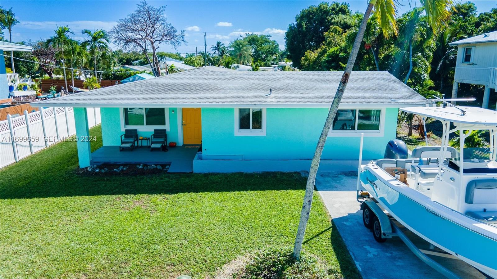 7951 Gulfstream Boulevard Marathon, FL 33050 - Photo 56 of 60 a front view of a house with garden