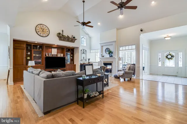 a living room with fireplace furniture and a flat screen tv