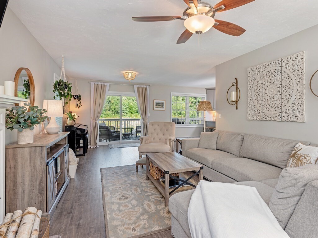 447 Ashby Road Ashburnham, MA 01430 - Photo 12 of 37 a living room with furniture a chandelier and a window