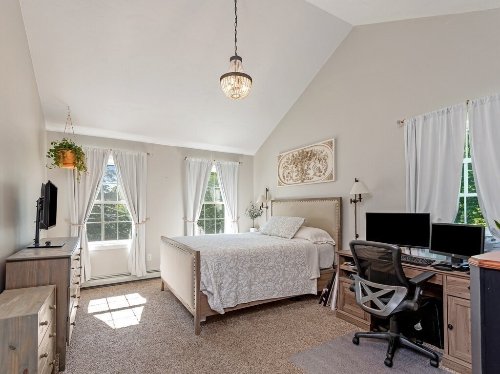 447 Ashby Road Ashburnham, MA 01430 - Photo 18 of 37 a bedroom with a bed and a flat screen tv