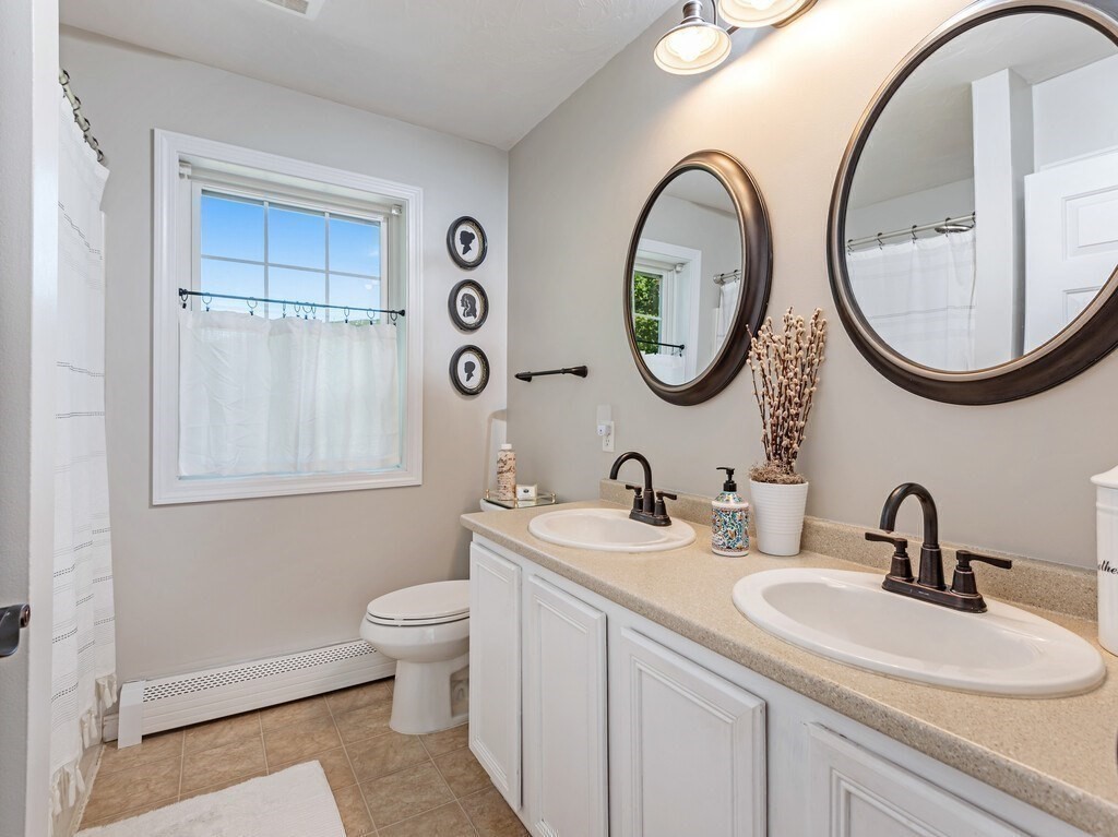 447 Ashby Road Ashburnham, MA 01430 - Photo 20 of 37 a bathroom with a toilet a sink and a mirror