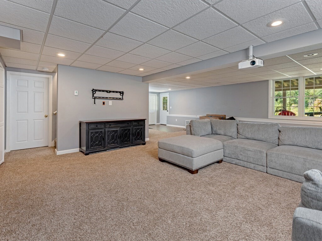 447 Ashby Road Ashburnham, MA 01430 - Photo 26 of 37 a spacious bedroom with a bed and a couch