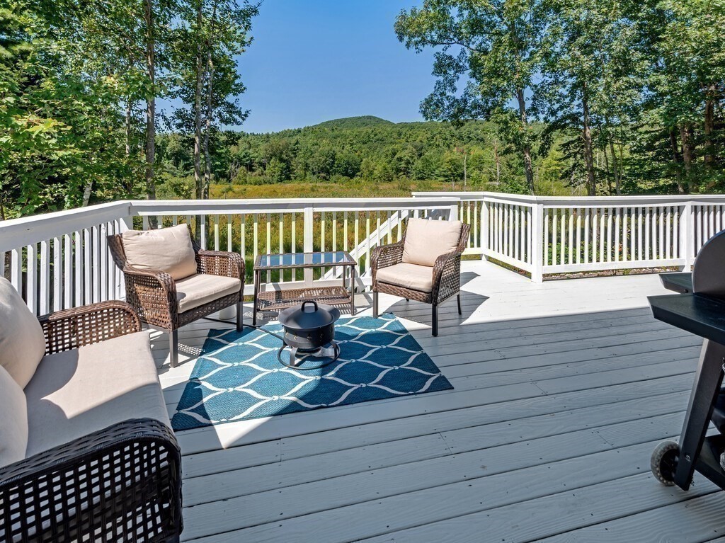447 Ashby Road Ashburnham, MA 01430 - Photo 29 of 37 a view of a chair and tables