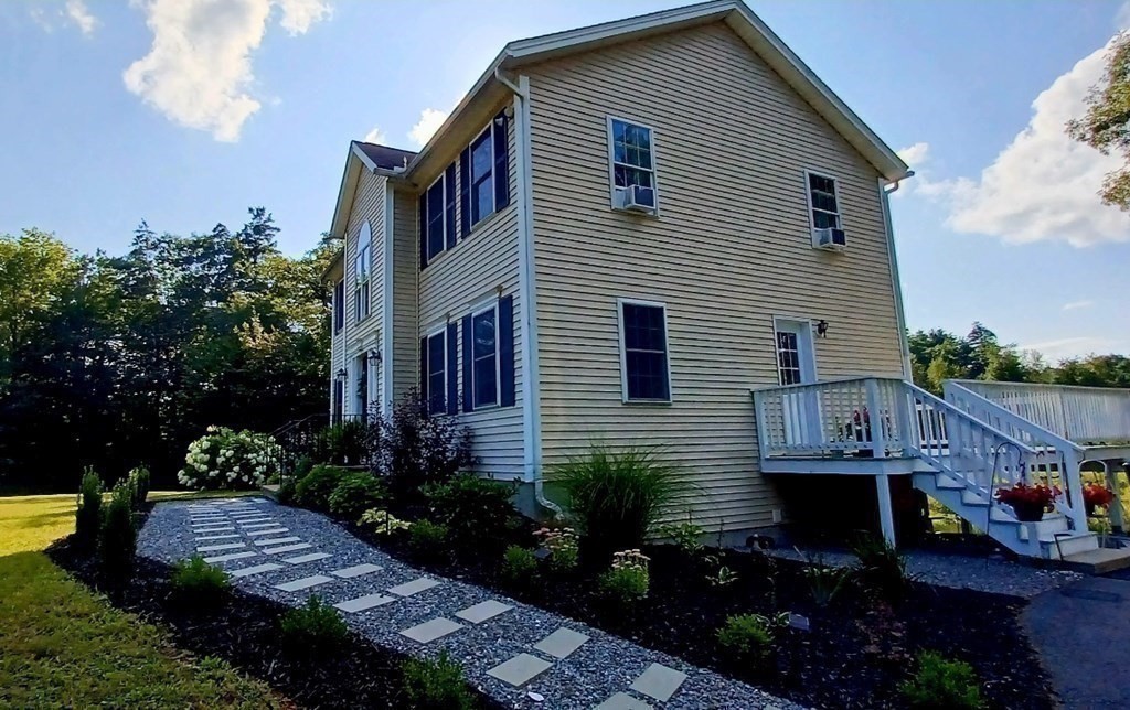 447 Ashby Road Ashburnham, MA 01430 - Photo 4 of 37 a view of a house with backyard and garden