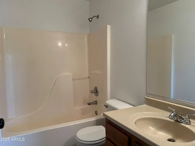 a bathroom with a sink and toilet