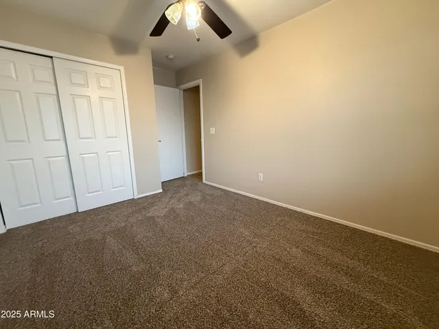 an empty room with a empty space and windows