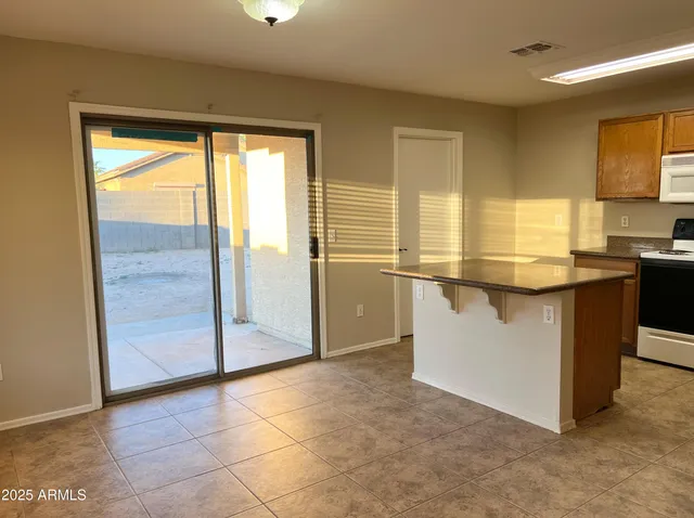 a view of a kitchen with a sink
