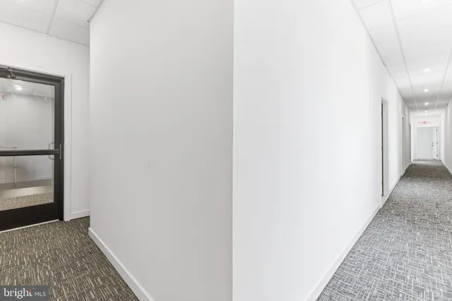 a kitchen with stainless steel appliances granite countertop a stove top oven and refrigerator