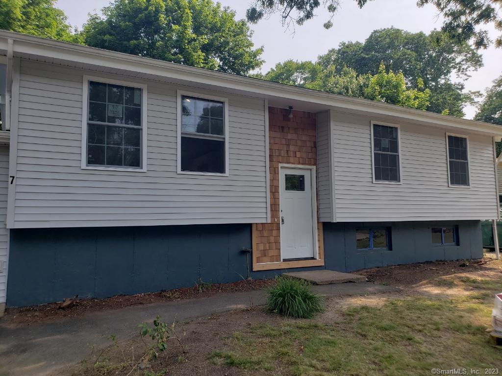 a front view of a house with garage