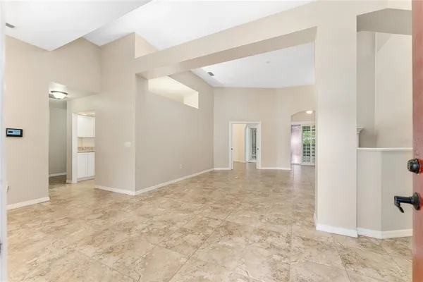 a view of a big room with wooden floor and a bathroom