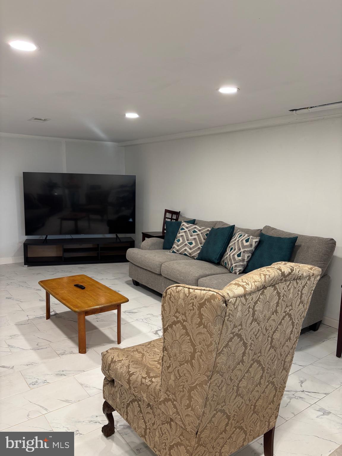 2483 Jericho Road Flint Hill, VA 22627 - Photo 2 of 18 a living room with furniture a flat screen tv and kitchen view
