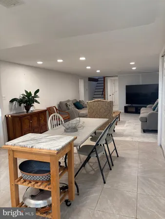 a kitchen with a table and chairs