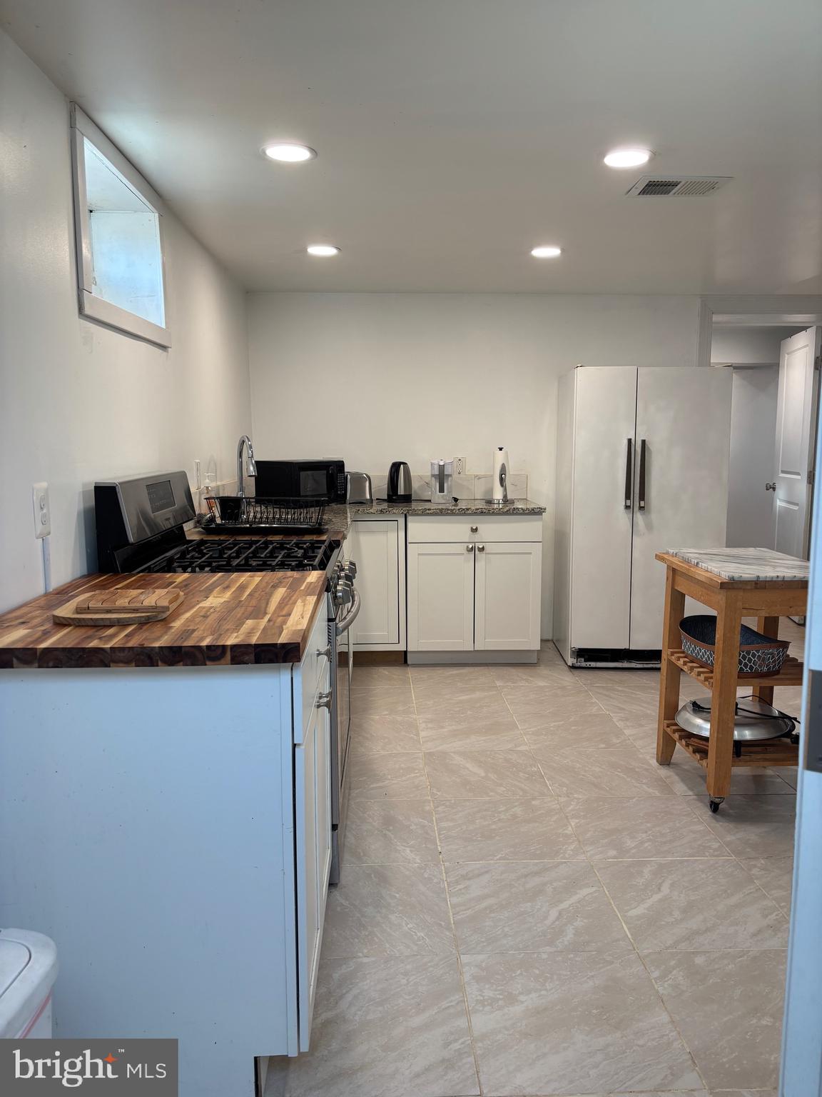 2483 Jericho Road Flint Hill, VA 22627 - Photo 7 of 18 a kitchen that has a lot of cabinets in it and wooden floors