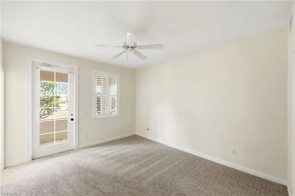 an empty room with a empty space and windows