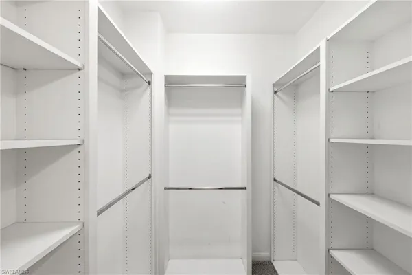 a view of an empty walk in closet